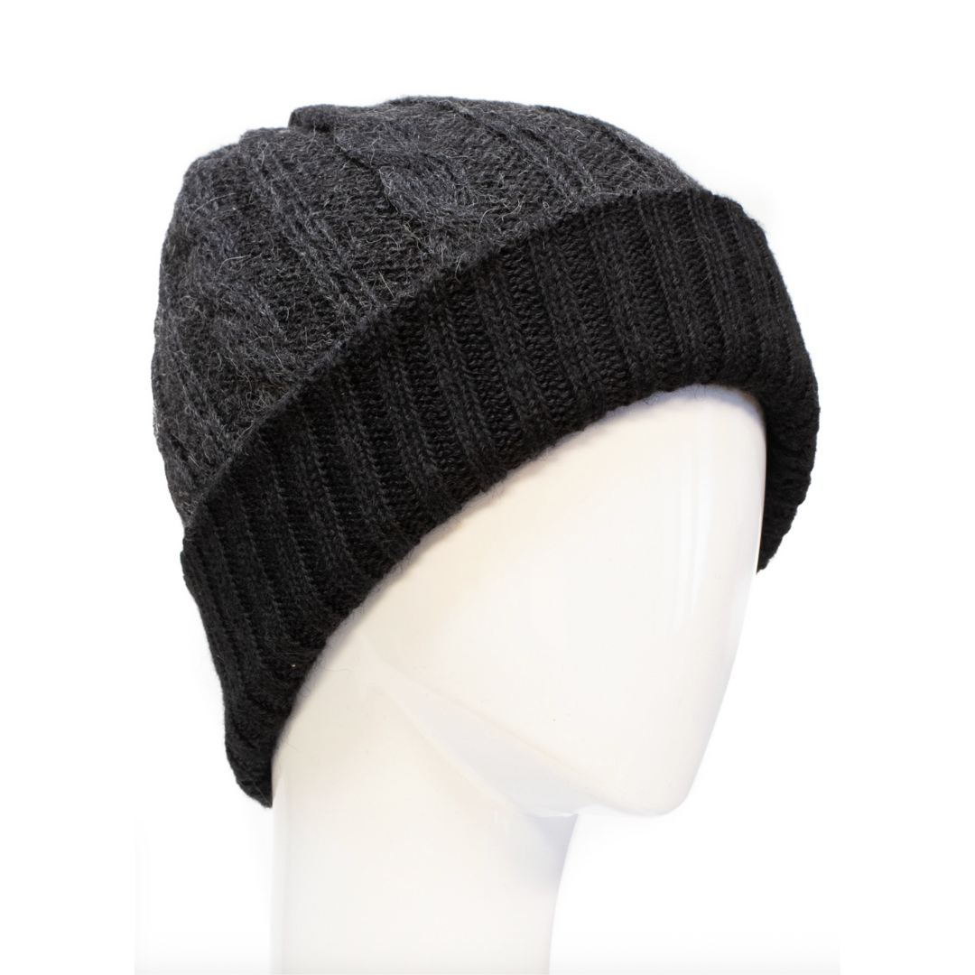 Dark gray knit beanie on a mannequin head against a white background