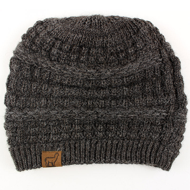 A gray textured alpaca slouch beanie with a small alpaca logo on the front.