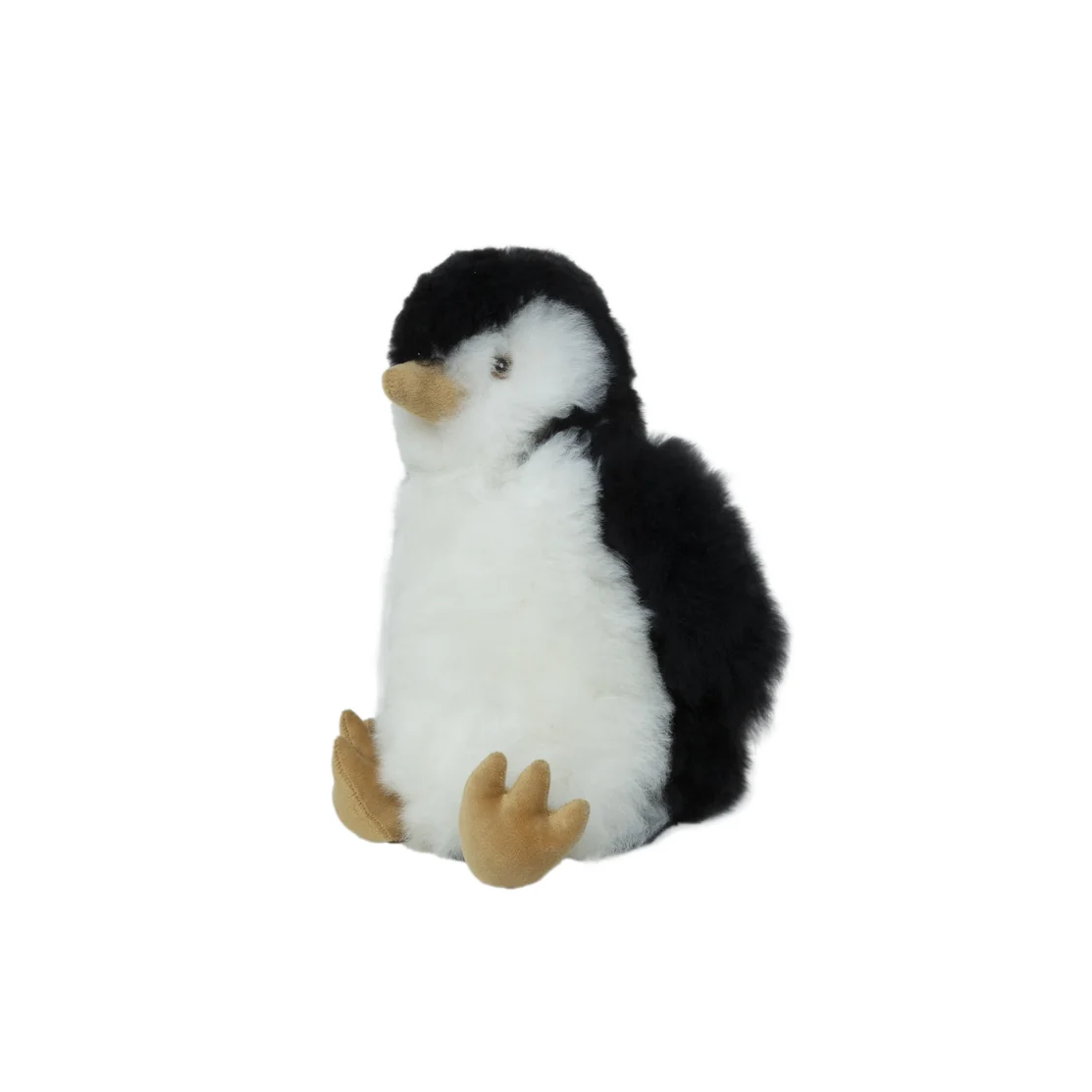A small plush penguin toy with black and white fur, a yellow beak, and yellow feet, centered on a plain white background.