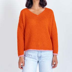 orange v neck baby alpaca long sleeve sweater modeled