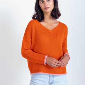 orange v neck baby alpaca long sleeve sweater modeled front view