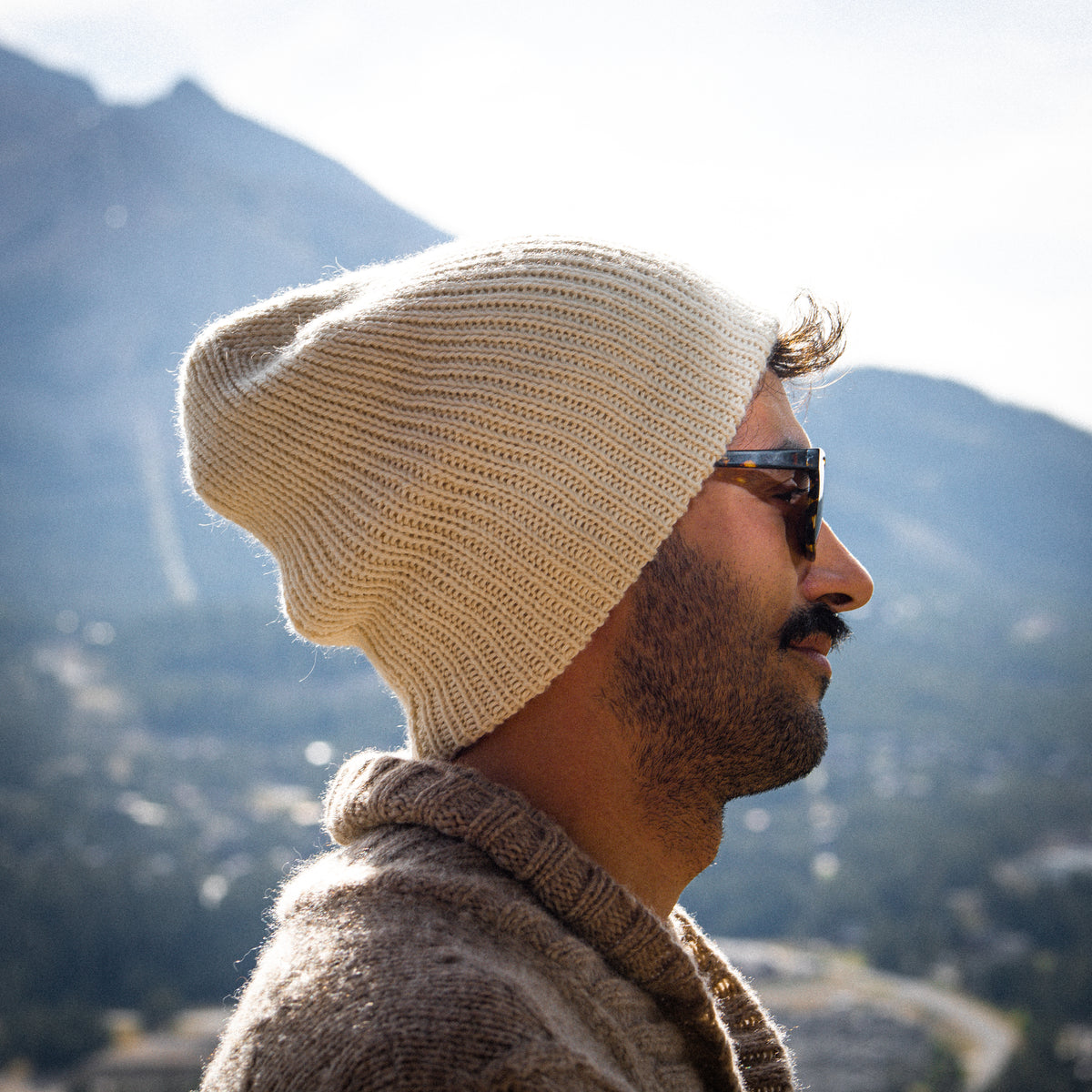 cream-mountain-viewCream baby alpaca beanie worn cuffed outdoors with a mountain view