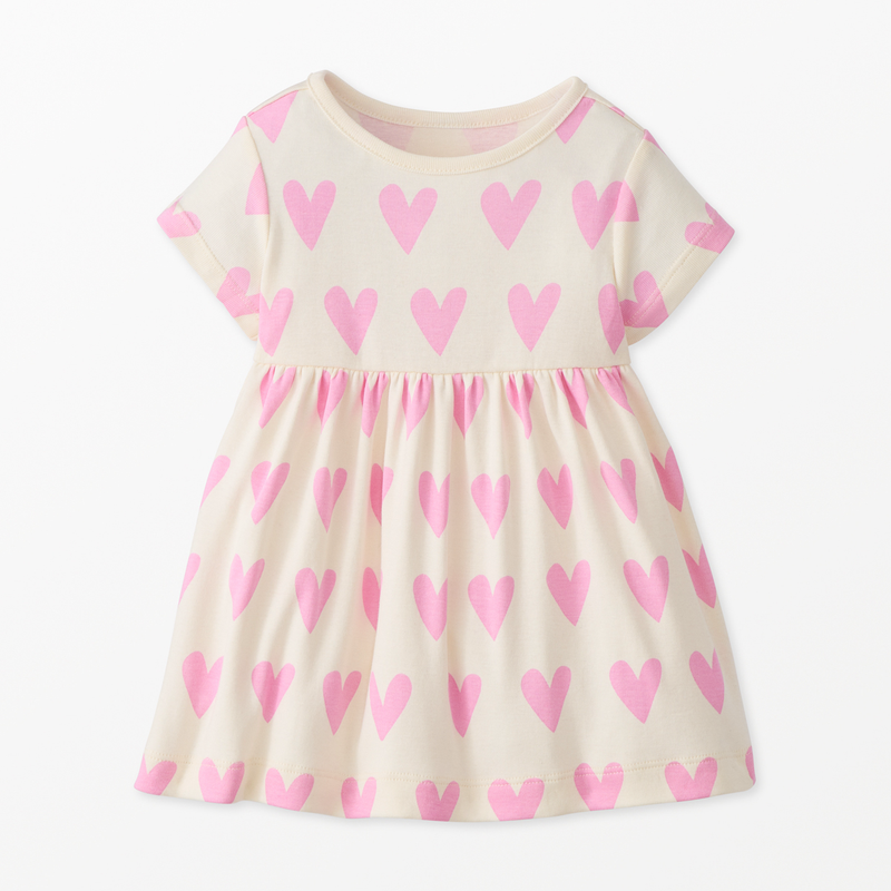 White dress with pink heart patterns on a white background