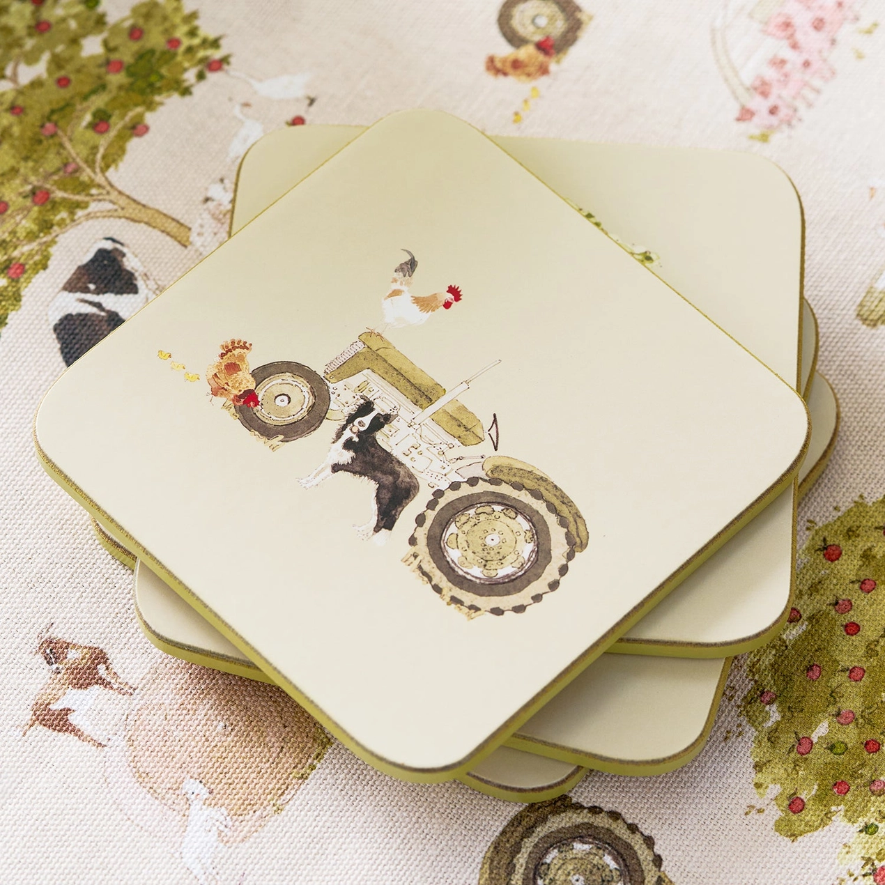 Set of coasters with a tractor design on a decorative surface
