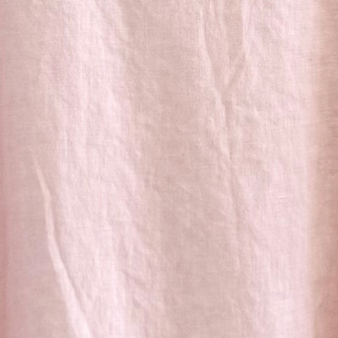 Close-up of light pink fabric texture