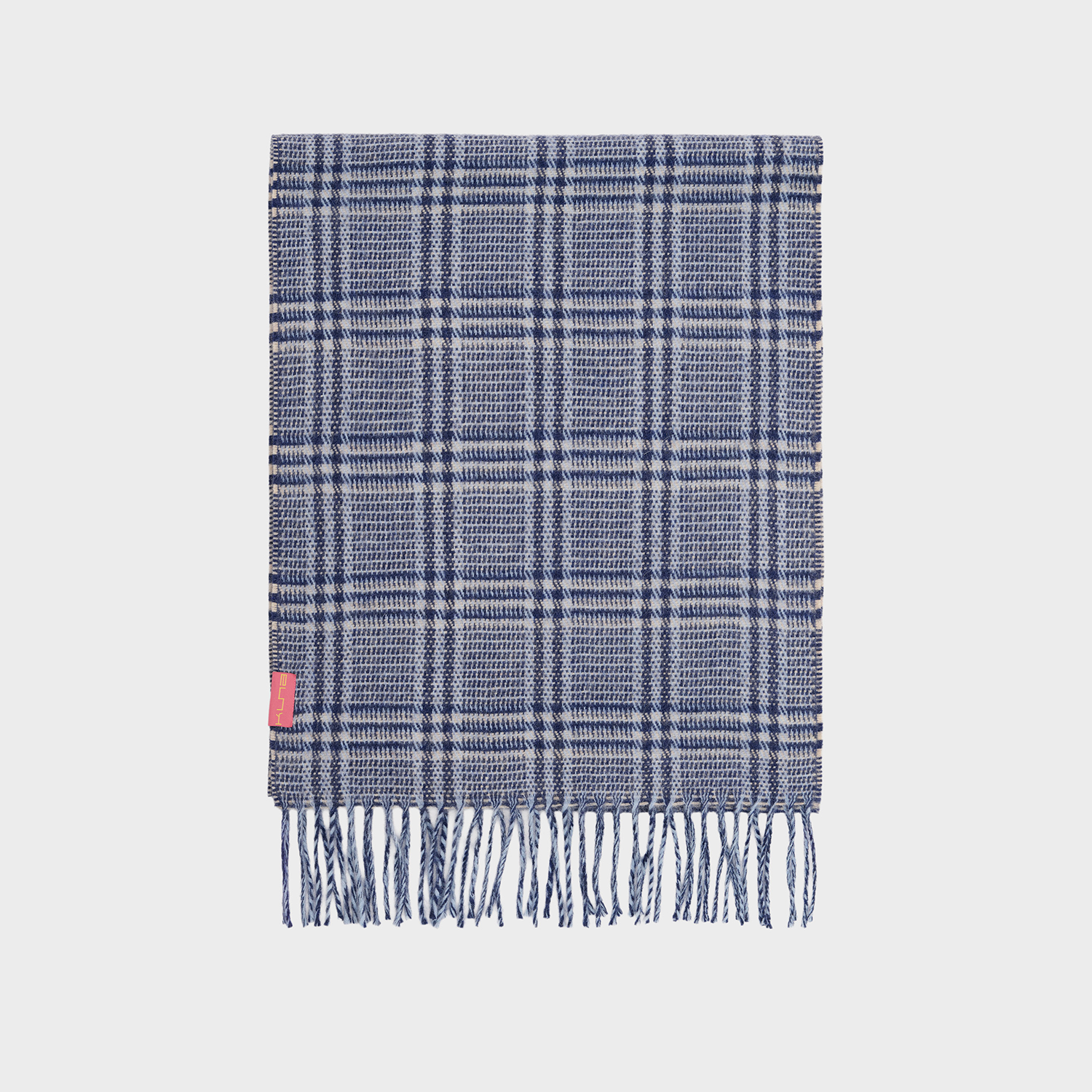 Blue plaid scarf with fringes on a light gray background