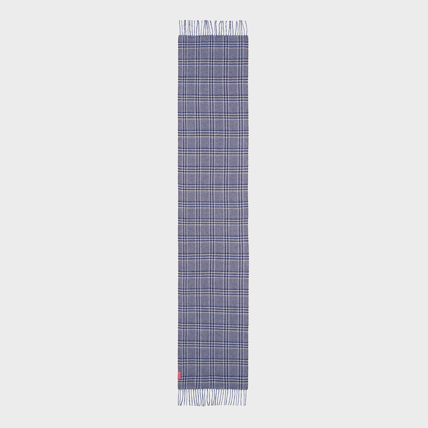 Plaid scarf with a red label on a white background