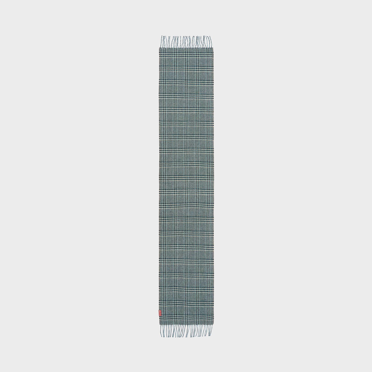 Green plaid scarf on a neutral background.