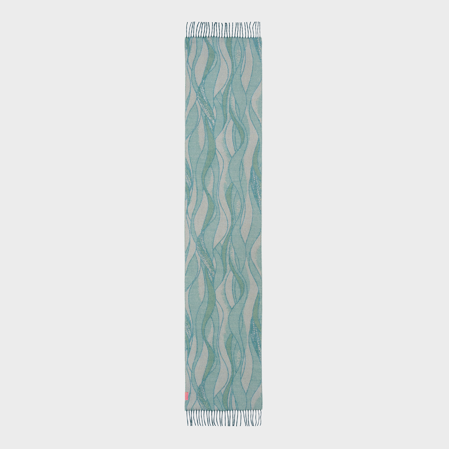 Teal and beige patterned scarf on a light gray background