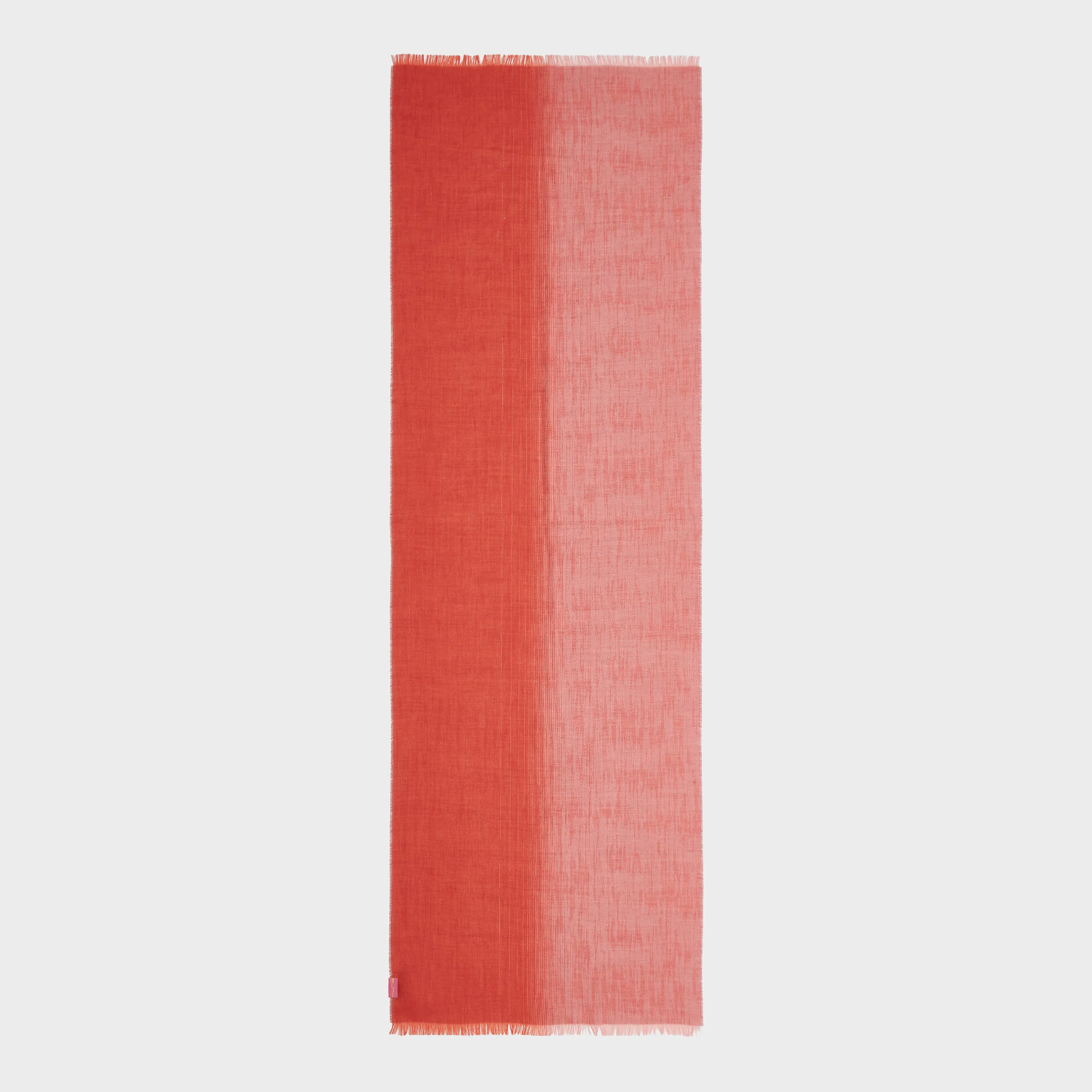 Red and pink gradient shawl on a light gray background