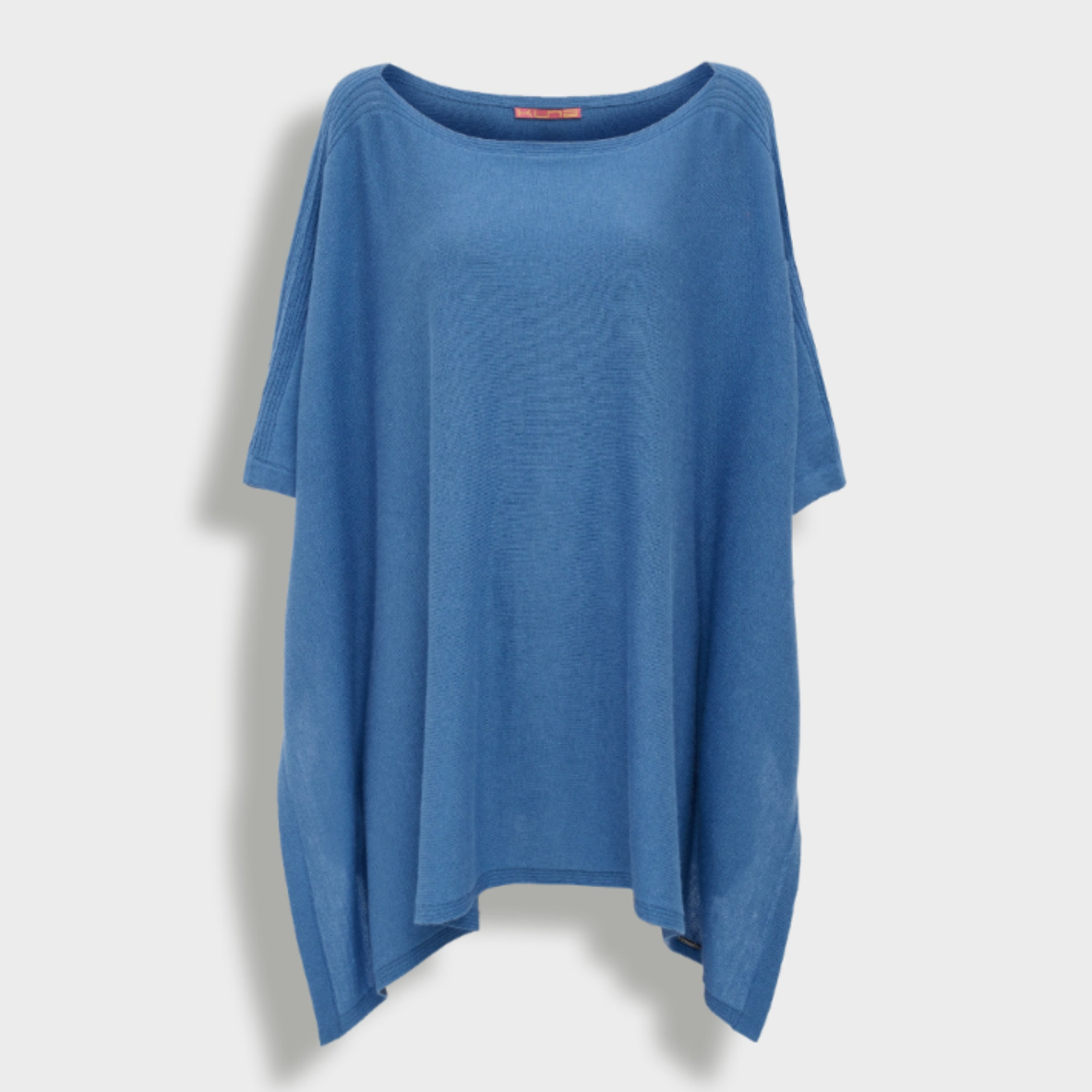 Blue poncho on a light gray background