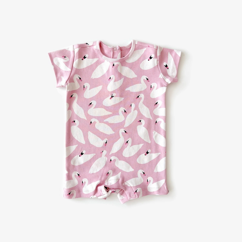 Pink baby romper with white bird pattern on a white background