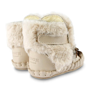 Donsje Owl Kapi Classic Lining Boots - leather and faux fur boots with owl features on a neutral background