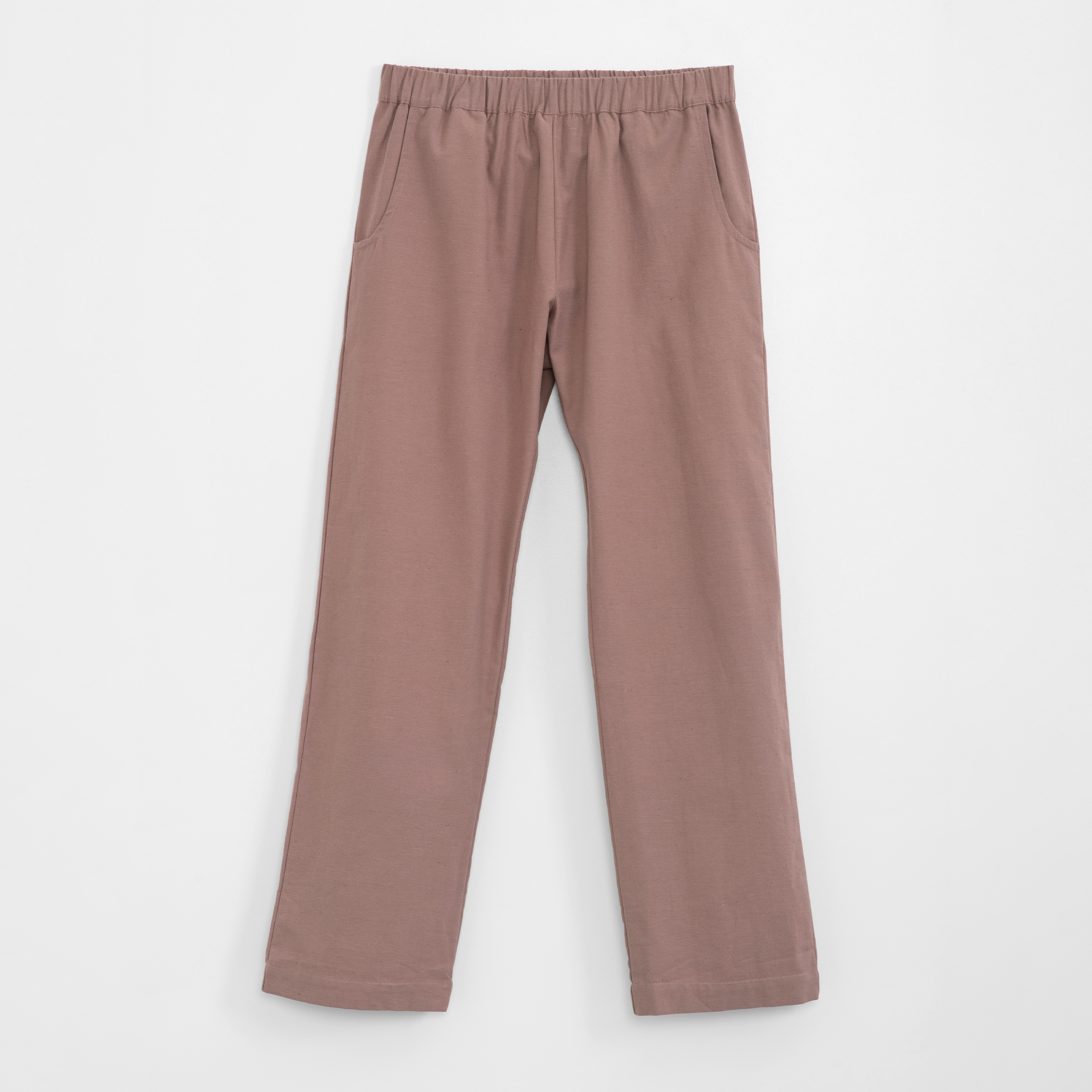 Pair of brown pants on a white background