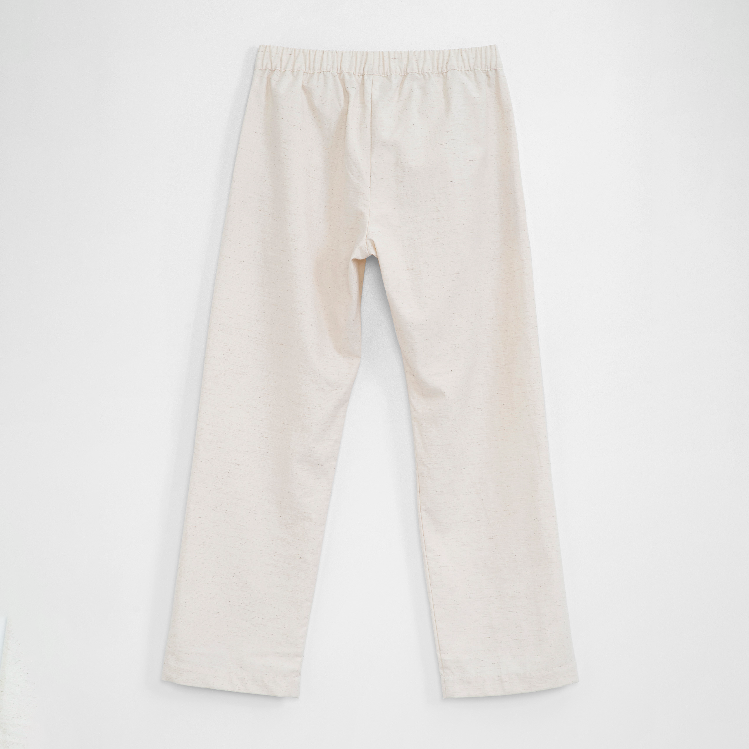 Back of off white pants on a white background
