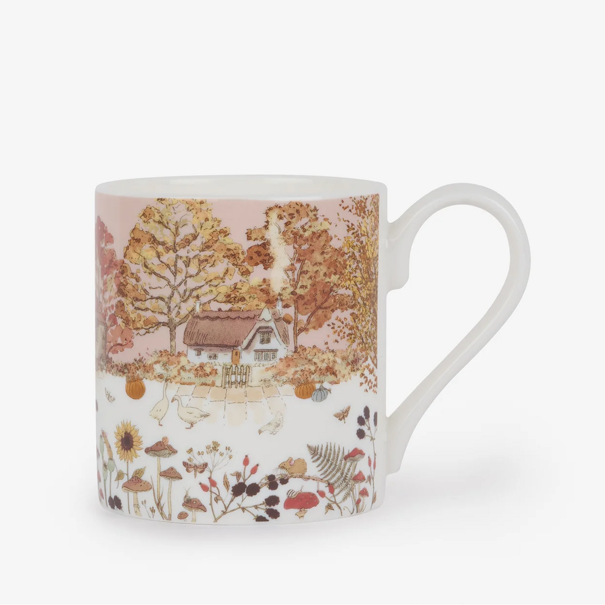 Mug with autumn-themed design featuring trees and a house on a white background
