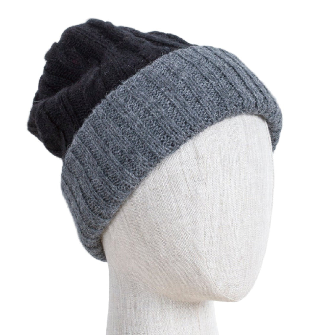 Two-toned black and gray knit beanie on a mannequin head against a white background