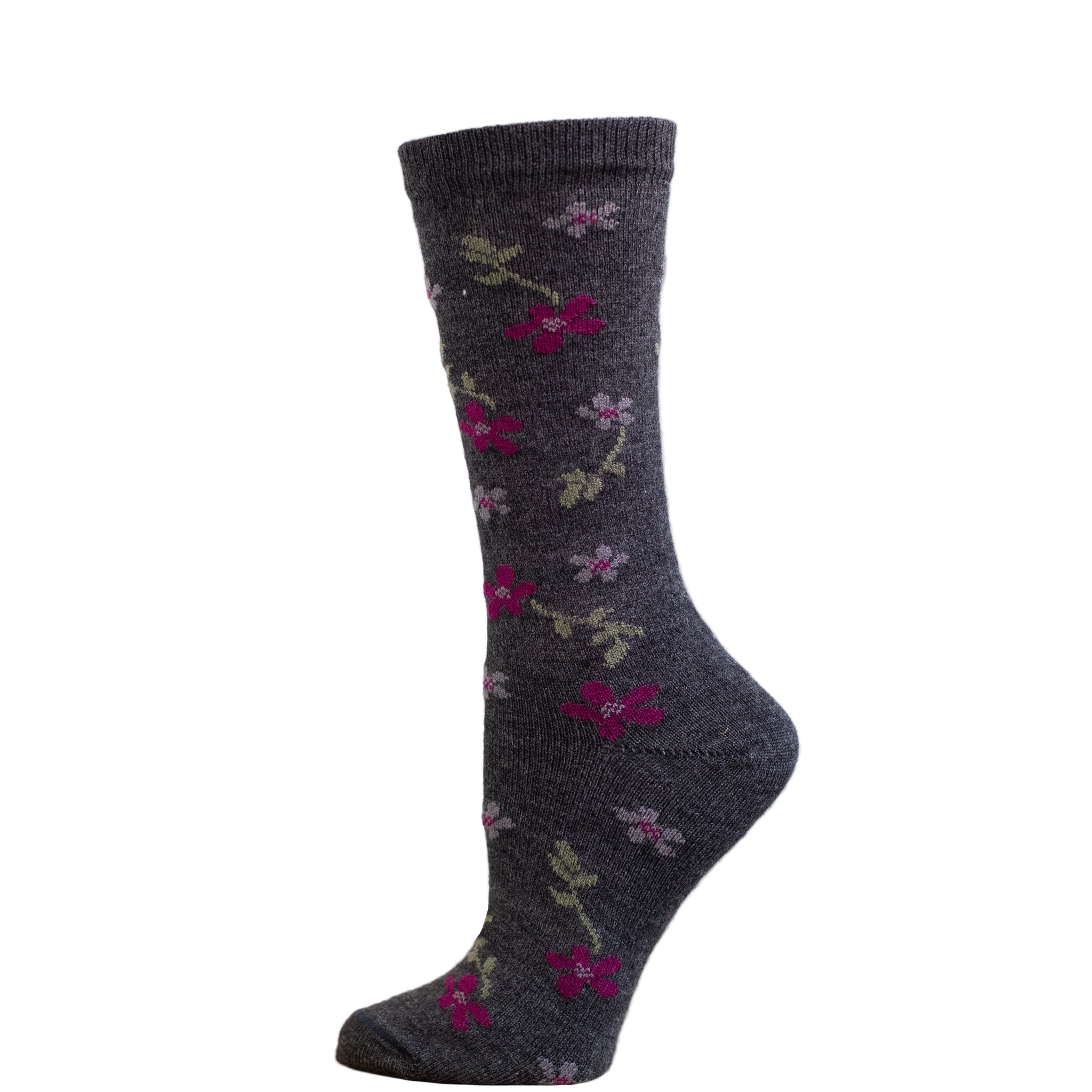 A pair of alpaca socks with a red maple flower pattern, displayed against a wooden backdrop.