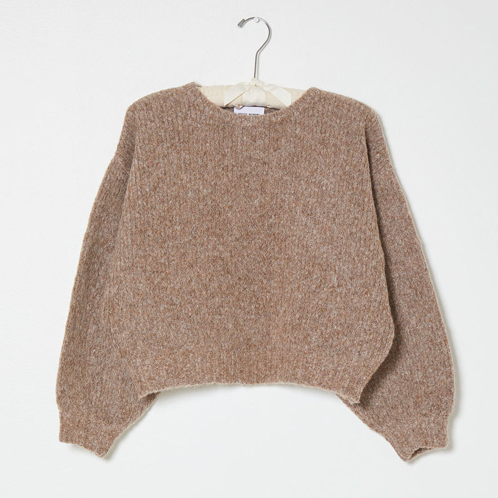 light brown knit sweater on a white background