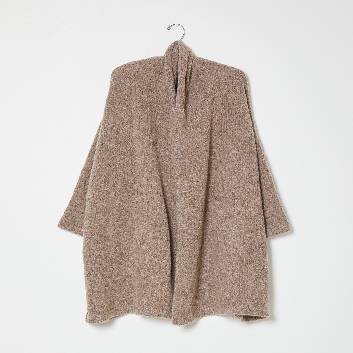 Beige knit wrap coat on white background