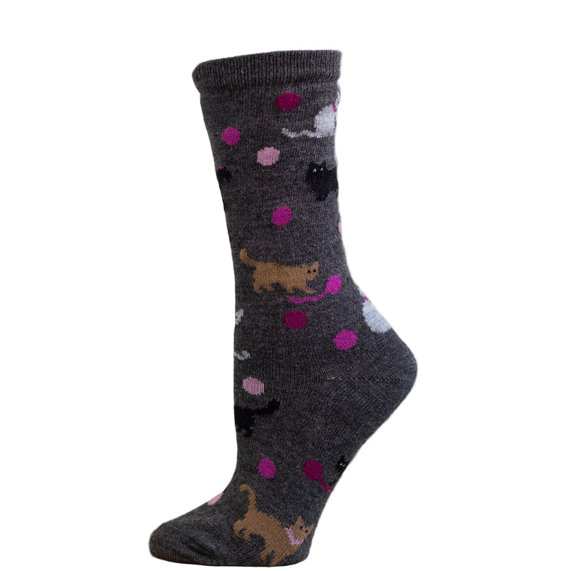 A crew style sock with a pattern of kittens in brown color on a charcoal background with purple dots.