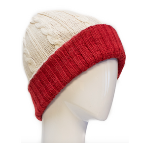 Knitted beanie with red and beige colors on a mannequin head against a white background