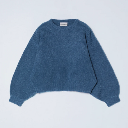 Blue sweater on a light gray background