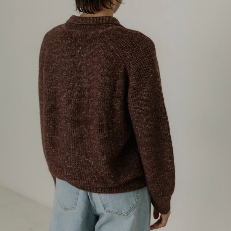 Bare Knitwear Alder Henley - person wearing marbled burgundy polo sweater on a neutral background