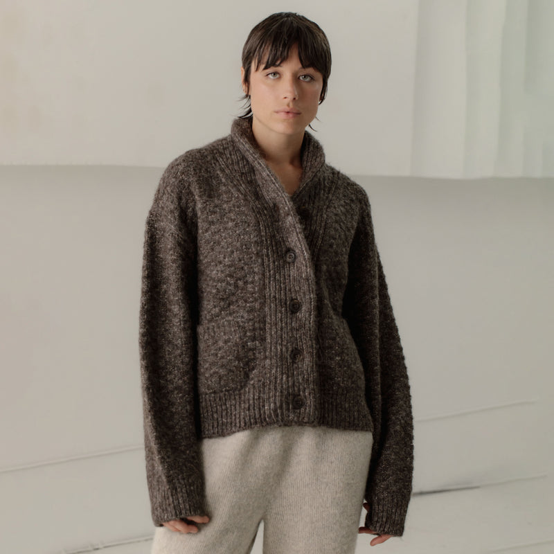 Bare Knitwear Bowen Shawl Cardigan - person wearing a marble brown button down cardigan on a neutral background