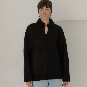 Bare Knitwear Felted Polo - person wearing black felted polo sweater on a neutral background
