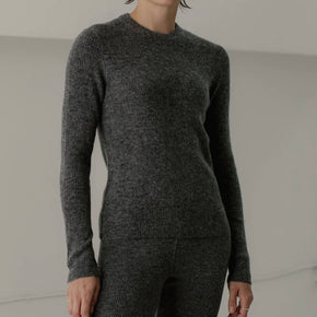 Bare Knitwear Marin Rib Top - person wearing a grey long sleeved top on a neutral background
