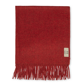 Red  throw with fringes on a white background