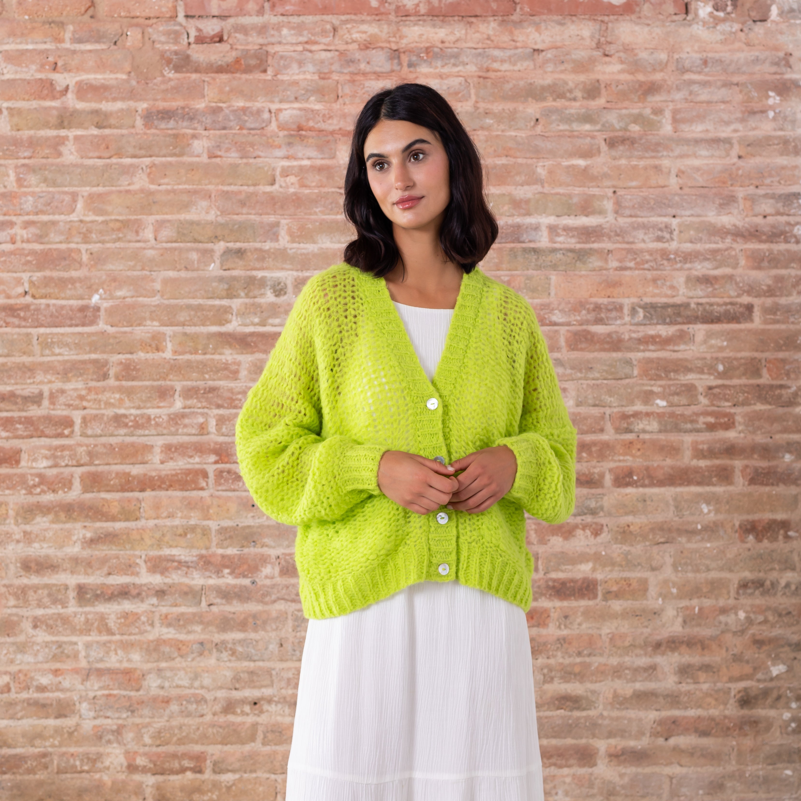 Light green baby alpaca cardigan v neck white buttons modeled front full view