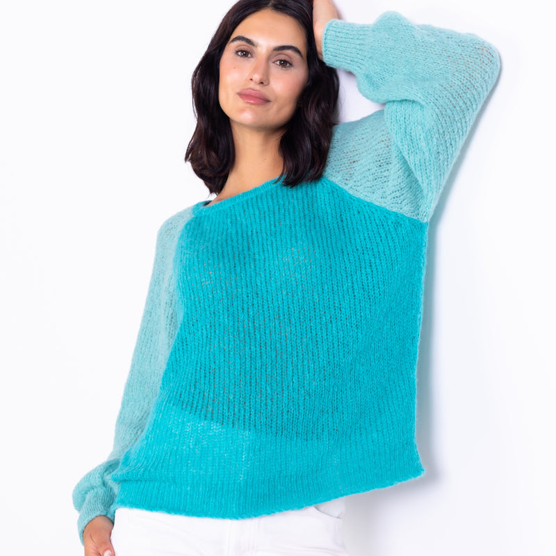 Teal color block baby alpaca sweater front view model