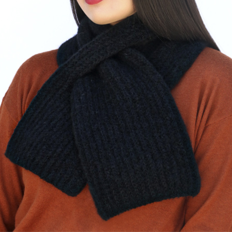 Black knitted scarf draped over a person wearing a brown sweater.