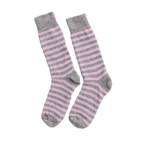 A pair of striped socks with gray and pink colors, laid flat on a surface.