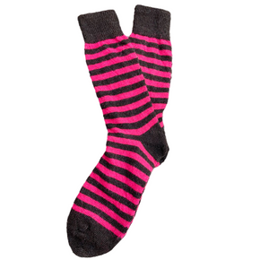 Pair of black and pink striped socks on a white background
