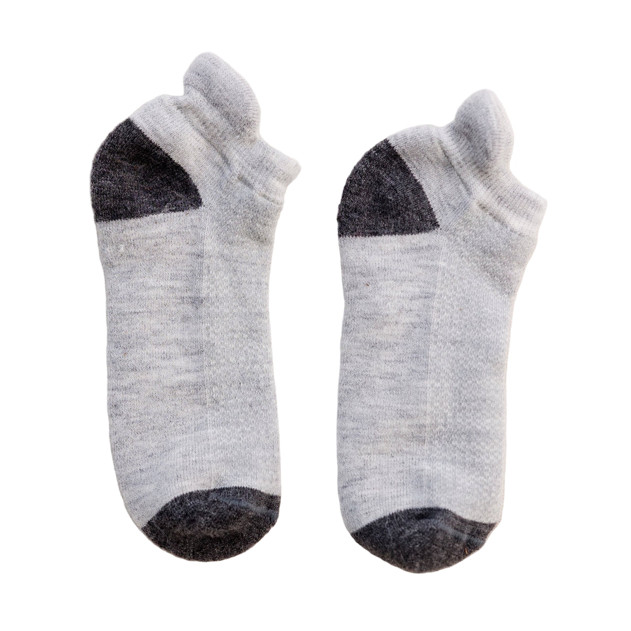 A pair of gray ankle-length running socks with black accents on the heel and toe areas.
