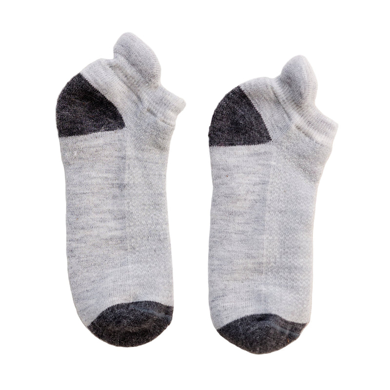 A pair of gray ankle-length running socks with black accents on the heel and toe areas.