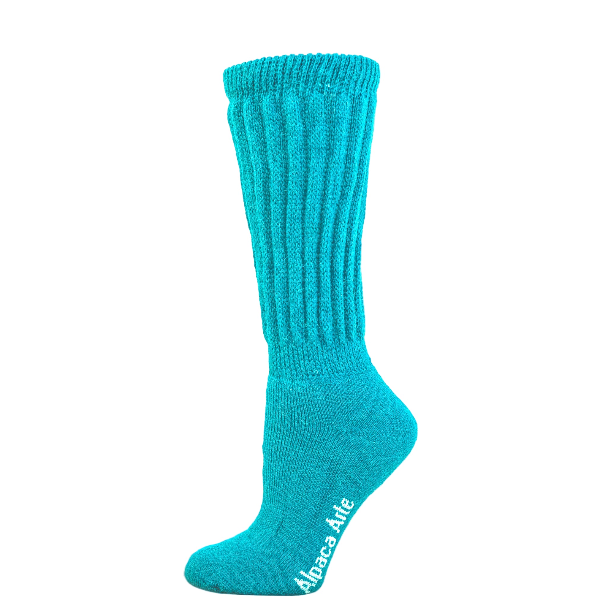 Tey-Art Therapeutic Ribbed Alpaca Socks - A foot on a wooden crate wears Turquoise Tey-Art Therapeutic Ribbed Alpaca Socks against a white background.