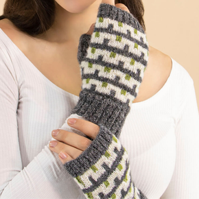 Person wearing a patterned gray and green fingerless glove on a beige background