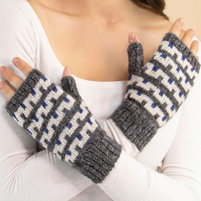 Person wearing gray and blue patterned fingerless gloves against a white background