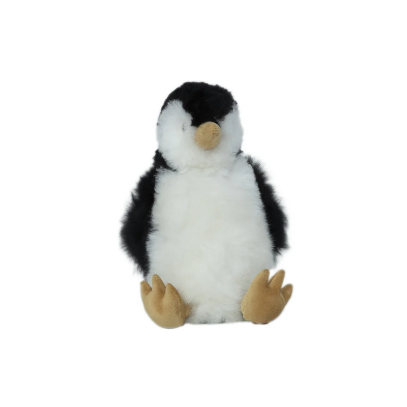A small plush penguin toy with black and white fur, a beige beak, and tan feet, centered on a plain white background.