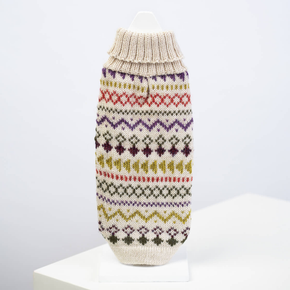 Knitted dog sweater with a colorful pattern on a white background