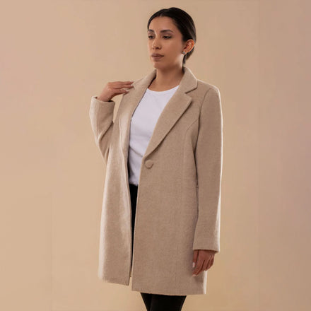 Front view of Amelia llama wool coat in beige, showcasing single button closure and soft texture.