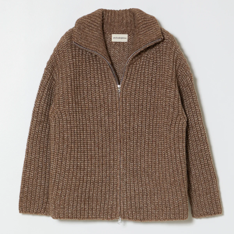 Ribbed knit zip up cardigan with turtleneck in brown on a neutral background.