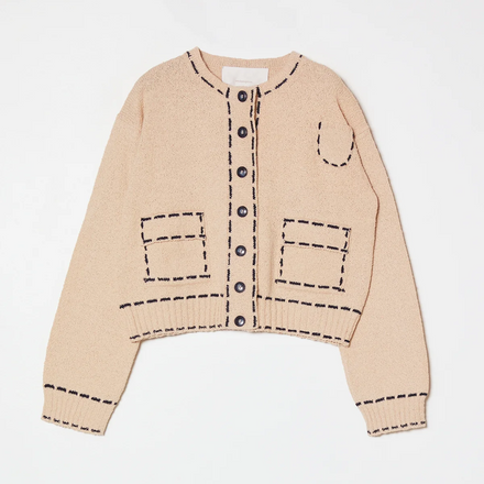 Beige cardigan with navy stitching on a white background