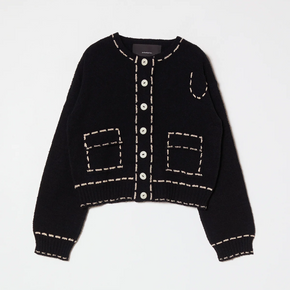 Black cardigan with tan stitching on a light gray background