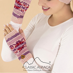 Woman wearing a pink knitted hat and matching arm warmers with a visible brand logo on a beige background.