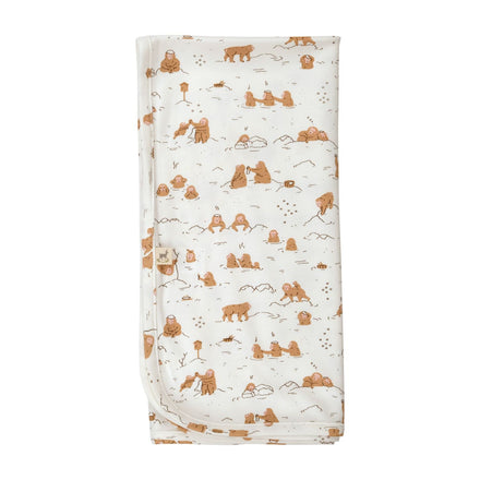 Red Caribou Baby Blanket - white blanket with monkey print on a neutral background